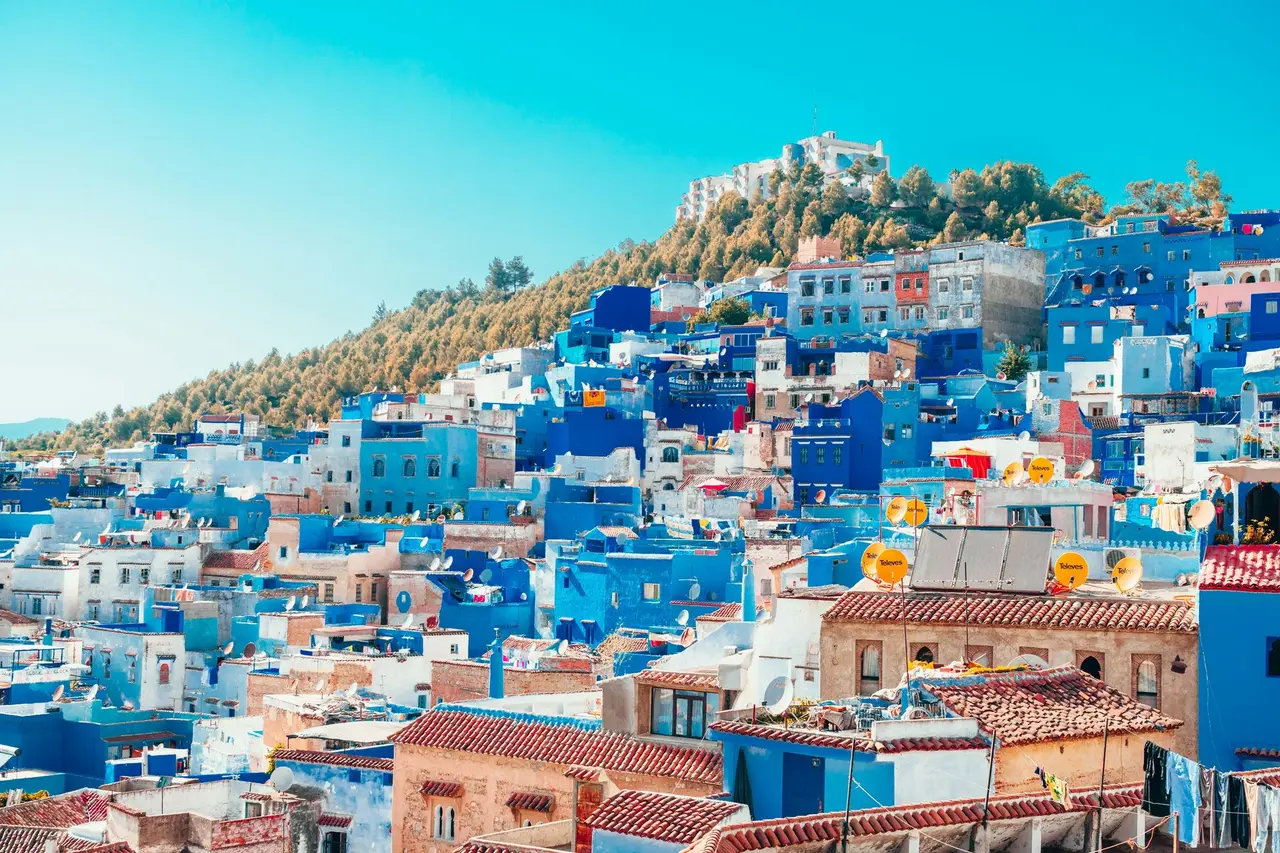 The blue-washed medina of Chefchaouen cascading down the hillside in the Rif Mountains