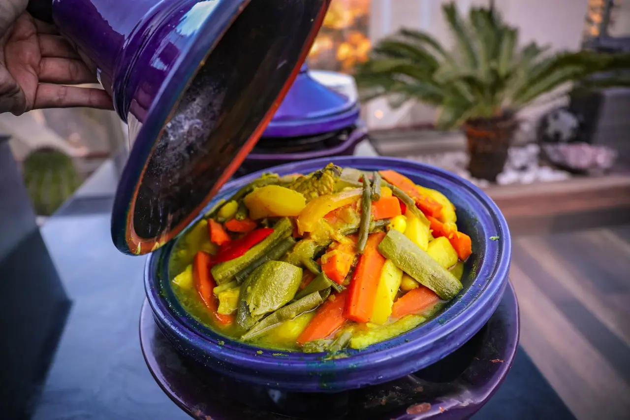 Vegetable tagine steaming in its conical clay pot
