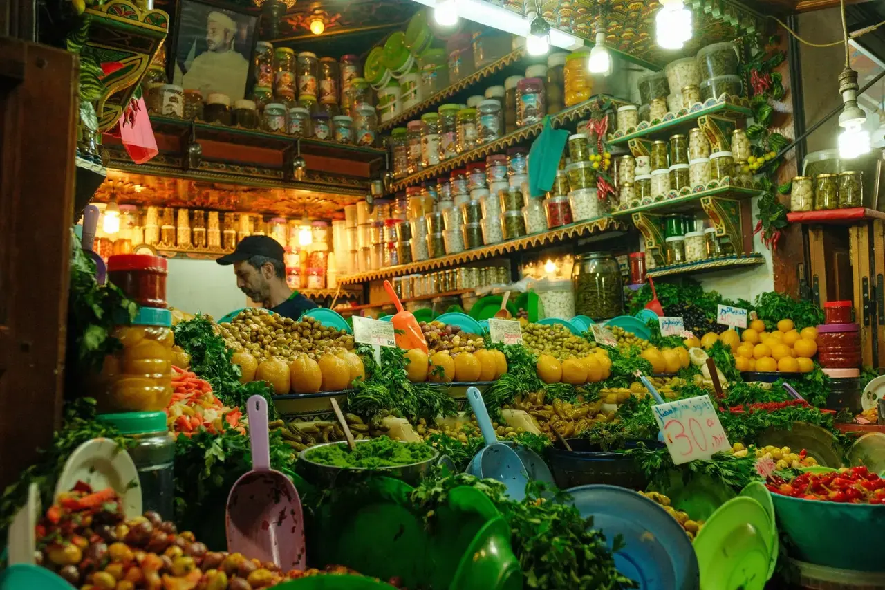 Baskets of olives and preserved lemons on a Moroccan market stall