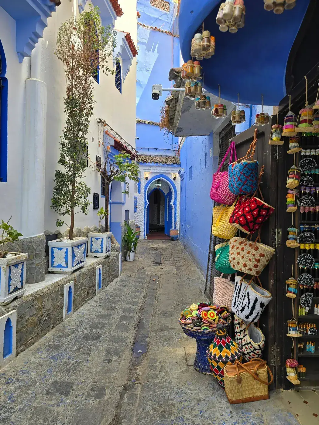 Handmade baskets and souvenirs displayed in a shop in Chefchaouen, Morocco