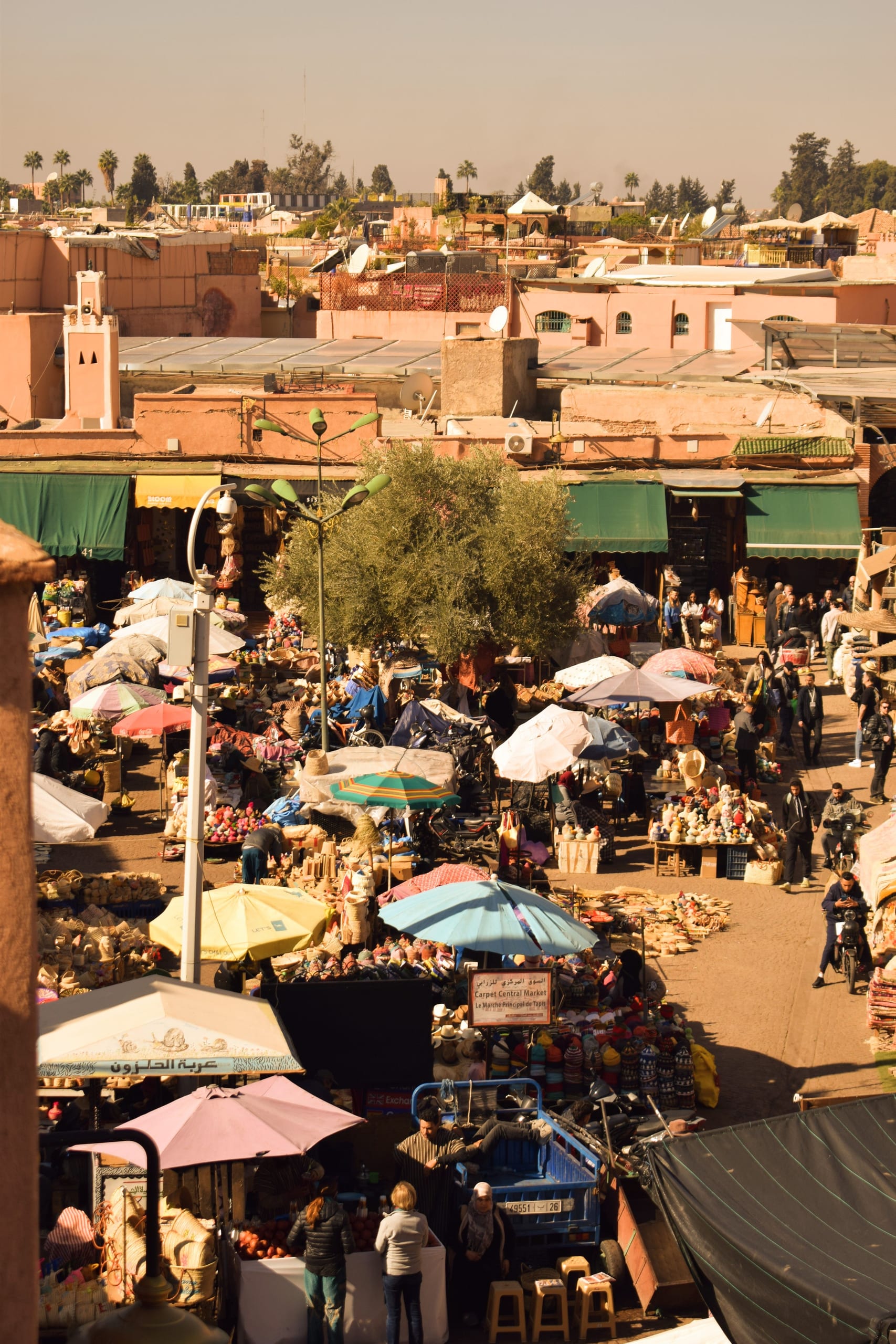 Aerial rooftop view over the colourful Marrakech souk, with Carpet Central Market visible