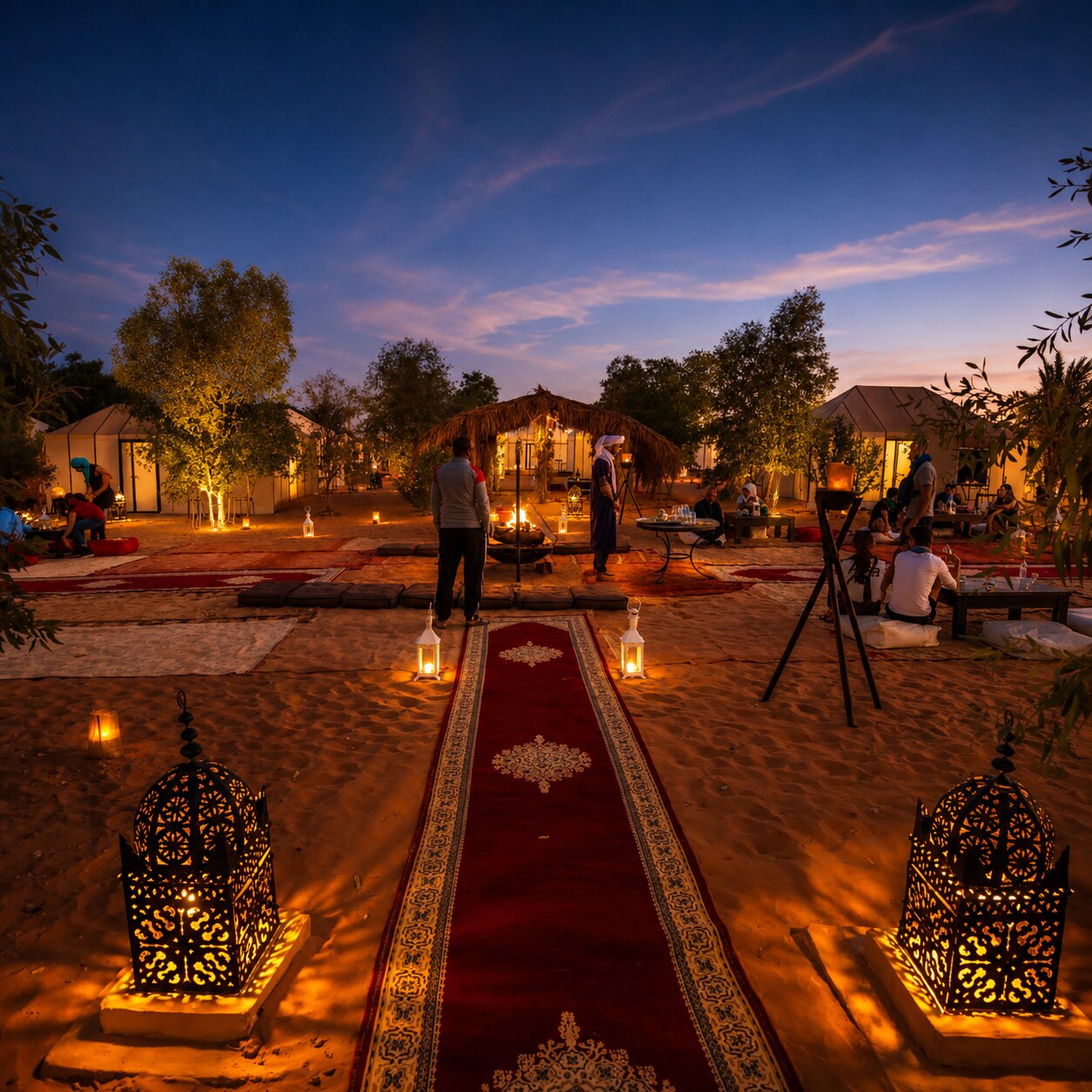 Luxury desert camp with private tents at sunset near Merzouga, Morocco