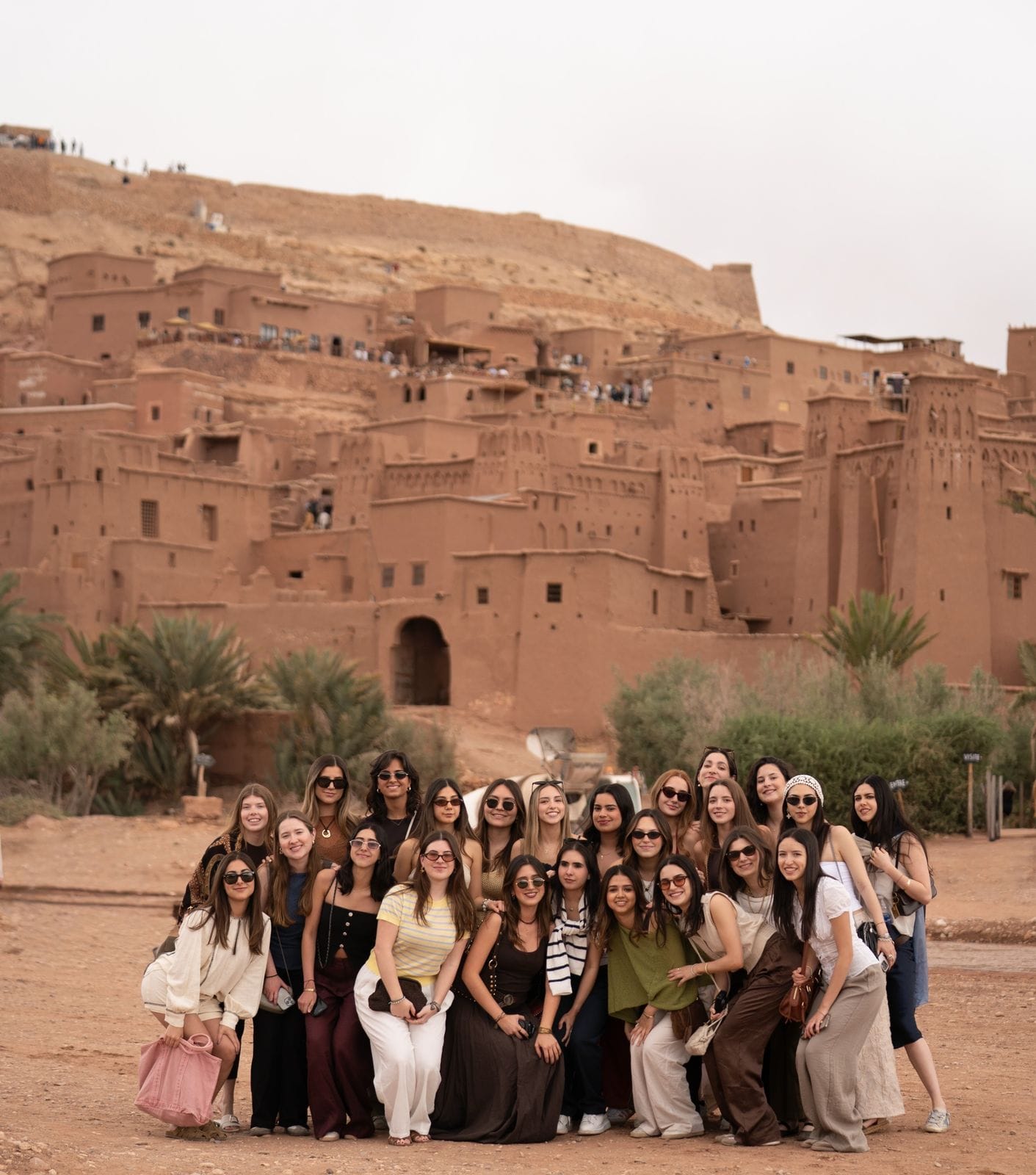 Student group in front of the earthen ksar of Aït Ben Haddou